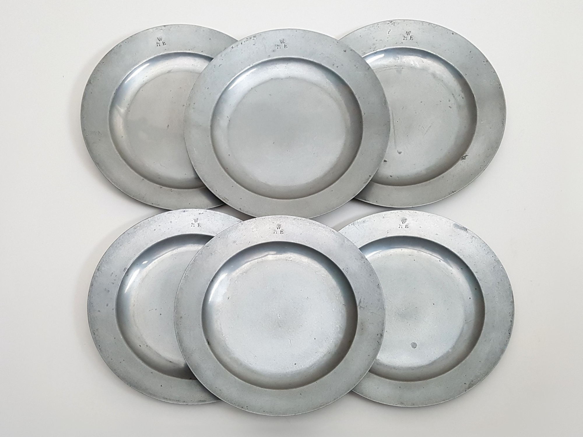 Set of six antique pewter Side Plates